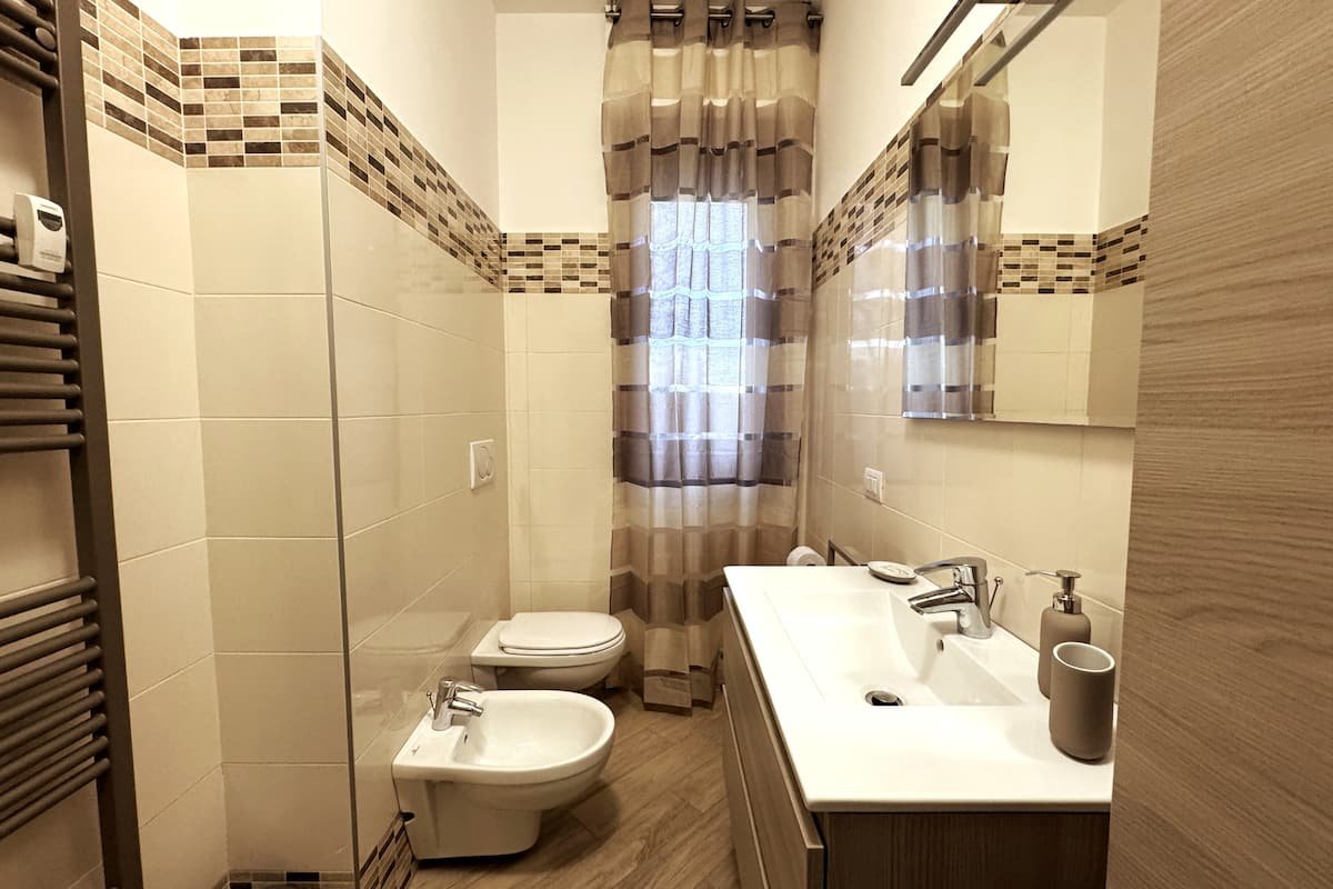Bagno e lavanderia di Dimora Cabiria
