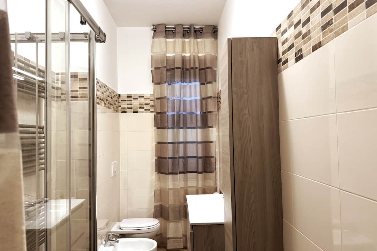Bagno e lavanderia di Dimora Cabiria