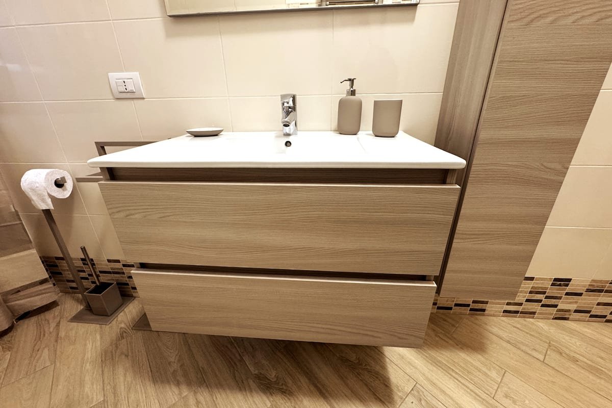 Bagno e lavanderia di Dimora Cabiria