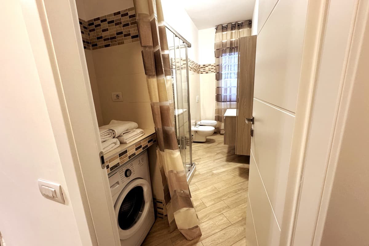 Bagno e lavanderia di Dimora Cabiria